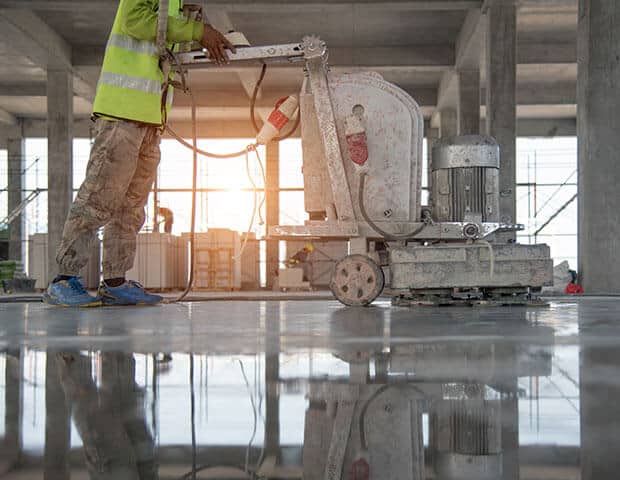 construction-worker-painting-epoxy-flooring